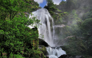 A Majestic Mountain Waterfall. Wallpaper