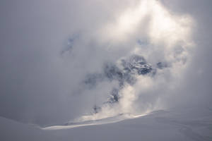 A Majestic View Of Snow-capped Mountains Wallpaper