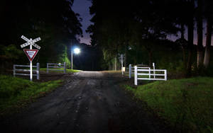 A Man Crosses The Road At Night Wallpaper