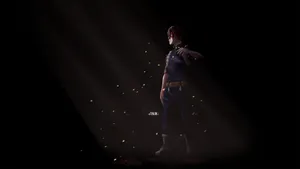 A Man In A Dark Room With A Flashlight Wallpaper