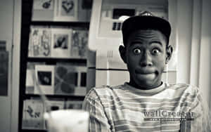 A Man Is Sitting In Front Of A Refrigerator Wallpaper