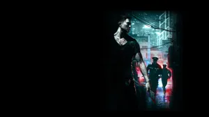 A Man Is Walking Down A Dark Street Wallpaper