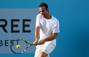 A Man Playing Tennis Wallpaper