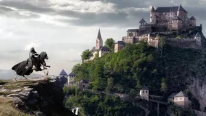 A Man Riding A Horse On A Cliff Near A Castle Wallpaper