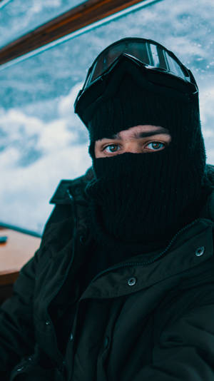 A Man Wearing A Black Mask And Goggles Wallpaper