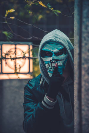 A Man Wearing A Mask Wallpaper