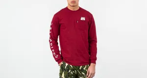 A Man Wearing A Red Long Sleeve Shirt And Camo Pants Wallpaper