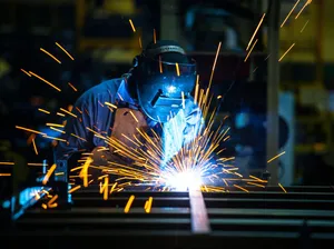A Man Welding Metal Wallpaper