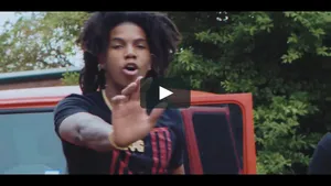 A Man With Dreadlocks Is Standing Next To A Truck Wallpaper