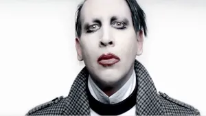 A Man With Makeup And A Coat Wallpaper