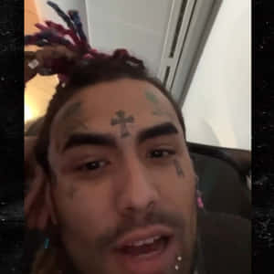 A Man With Tattoos On His Face Wallpaper