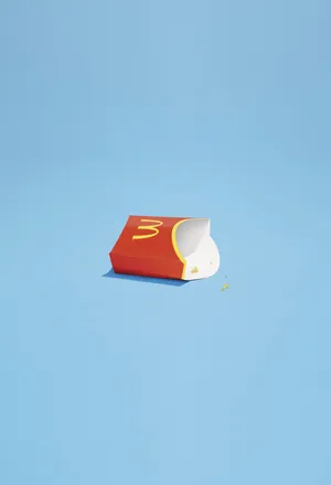 A Mcdonald's Bag On A Blue Surface Wallpaper
