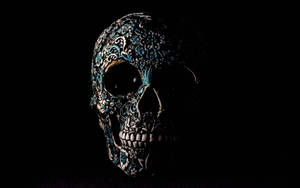 A Menacing Skull Made Of Black Stone Wallpaper