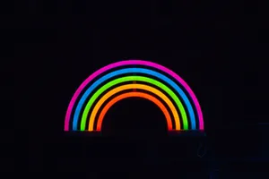 A Mesmerising Display Of Neon Hues In Darkness Wallpaper