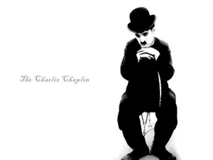 A Mesmerizing Shot Of Charlie Chaplin During One Of His Heartfelt Moments. Wallpaper