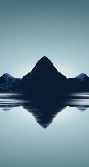 A Mountain Range Is Reflected In The Water Wallpaper