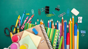 A Myriad Of Vibrant School Supplies Illustrated Creatively Wallpaper