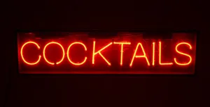 A Neon Sign That Says Cocktails Wallpaper