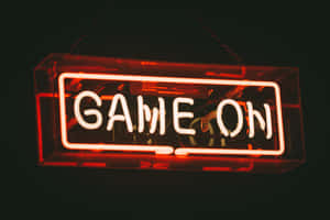 A Neon Sign That Says Game On Wallpaper