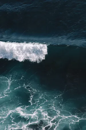 “a Perfect Wave Of Calm Blue Water” Wallpaper
