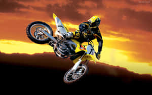 A Person Riding A Dirt Bike Wallpaper