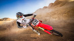 A Person Riding A Dirt Bike Wallpaper