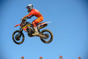 A Person Riding A Dirt Bike Wallpaper