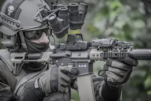 A Person With A Powerful And Precise Gun Wallpaper
