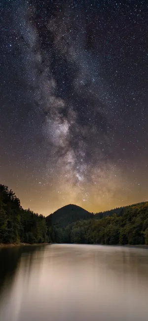 “a Photo Of A Sunrise Behind A Mountain Range.” Wallpaper