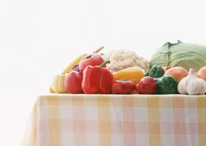A Picnic Table Overflowing With Fresh Vegetables Wallpaper