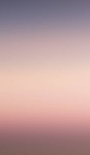 A Pink And Purple Sunset With A Plane In The Background Wallpaper