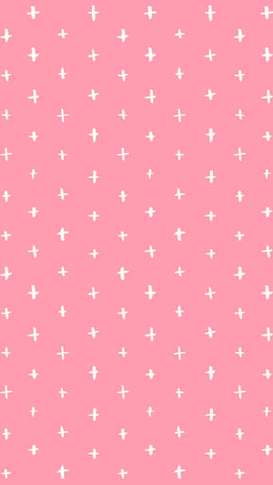A Pink Background With White Crosses On It Wallpaper