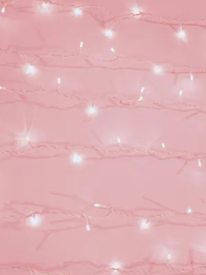 A Pink Background With White Lights On It Wallpaper