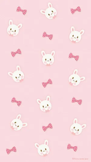 A Pink Bunny On A Bed Of Green Grass, Enjoying The Summer Sun. Wallpaper