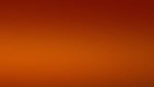 A Plane Flying Over An Orange Sky Wallpaper