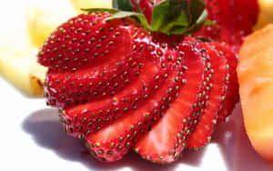 A Plate Of Fruit With Strawberries And Pineapple Wallpaper