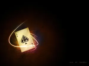A Playing Card With A Light Shining On It Wallpaper
