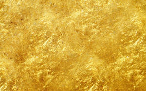 A Pristine Sheet Of Gleaming Gold Wallpaper