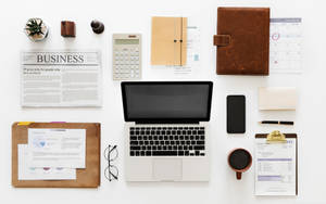 A Professional Day At A Chartered Accountant's Desk Wallpaper