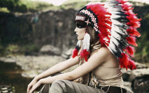 A Profile Of An Empowered Woman Wearing An Indian Warbonnet Wallpaper