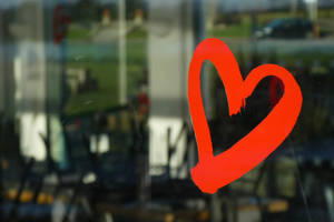 A Radiant Heart Drawing On A Misted Glass Wallpaper