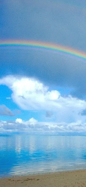 A Rainbow Over A Beach Wallpaper