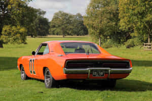 A Red And Orange Car Parked In A Field Wallpaper