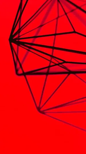 A Red Background With A Black And White Geometric Shape Wallpaper