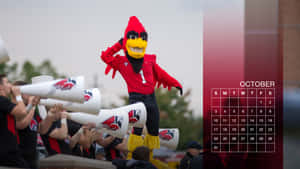 A Red Cardinal Mascot Is Holding A Horn Wallpaper