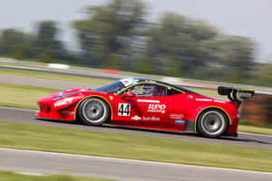 A Red Ferrari Racing Car Wallpaper