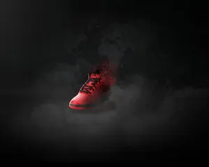 A Red Shoe With Smoke Coming Out Of It Wallpaper