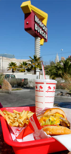 A Red Tray With A Hamburger And Fries Wallpaper