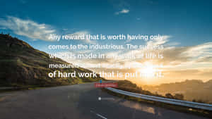 A Road With A Quote About The Road And The Life Wallpaper