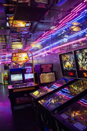 A Room Full Of Pinball Machines Wallpaper